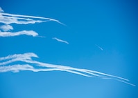 U.S. Air Force F-22 Raptors fly over Joint Base Elmendorf-Richardson, Alaska, following a close formation taxi known as an elephant walk, May 5, 2020. This event displayed the ability of the 3rd Wing, 176th Wing and the 477th Fighter Group to maintain constant readiness throughout COVID-19 by Total Force Integration between active-duty, Guard and Reserve units to continue defending the U.S. homeland and ensuring a free and open Indo-Pacific.