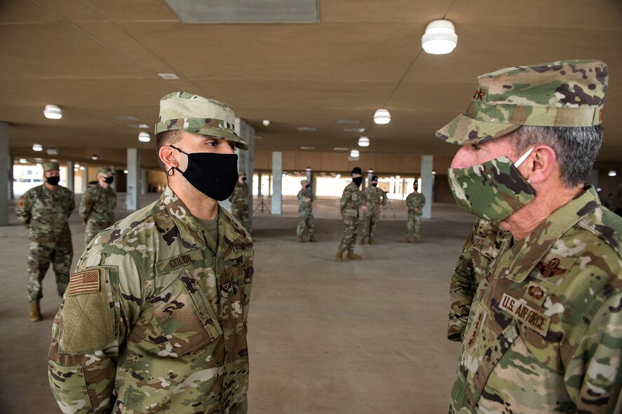 Air Force Chief of Staff Gen. David L. Goldfein talks with an Airman after basic military training graduation May 7, 2020, at Joint San Antonio-Lackland, Texas.