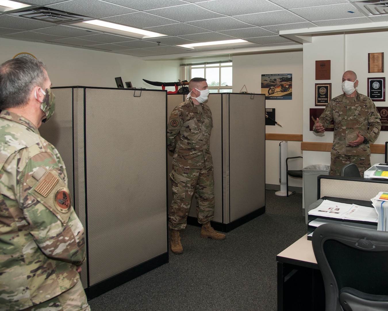 While performing the duties of Under Secretary of the Air Force Shon Manasco and Chief Master Sgt. of the Air Force Kaleth O. Wright listen to Master Sgt. Brandon Long, 37th Training Wing Detachment 5 military training instructor, as he briefs on the physical-training procedures used by basic military trainees at Keesler Air Force Base, M