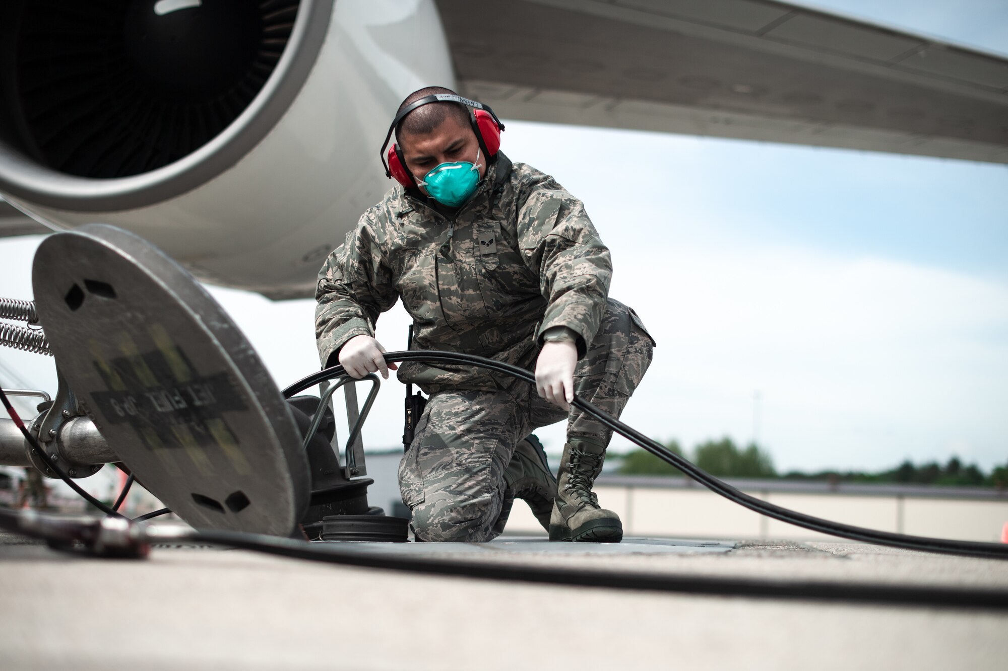 Photo of Airman refueling a jet