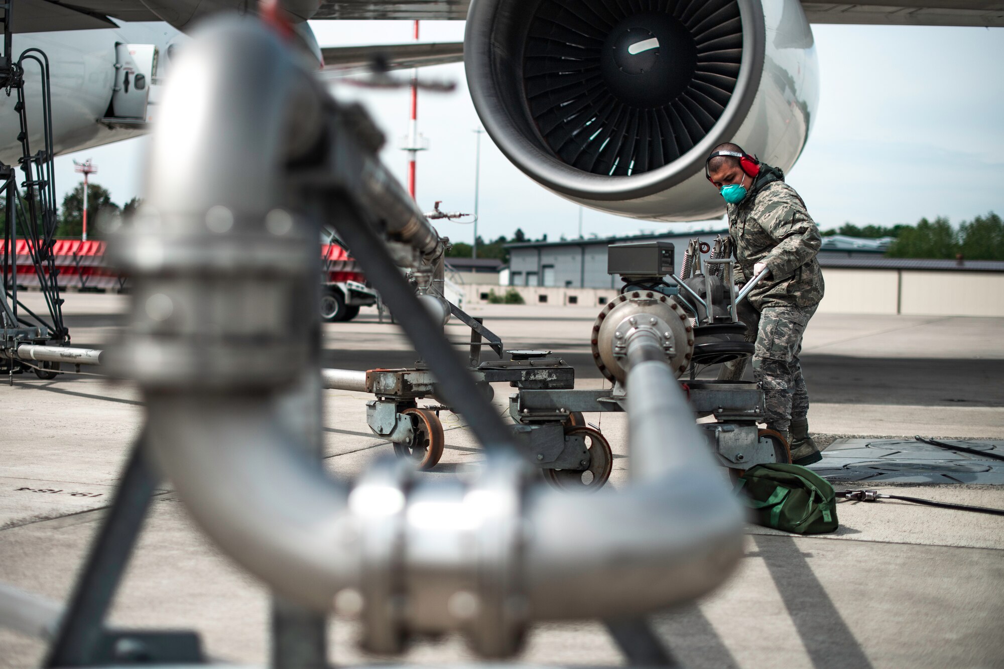 Photo of Airman refueling a jet