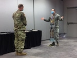 Air Force Chaplain (Lt. Col.) Jake Marvel, with the New York Air National Guard, gives Holy Communion to a U.S. Army Soldier at New York City’s Jacob K. Javits Convention Center on Easter Sunday. Marvel was mobilized to the alternate care facility in April as part of a Religious Support Team in response to COVID-19.