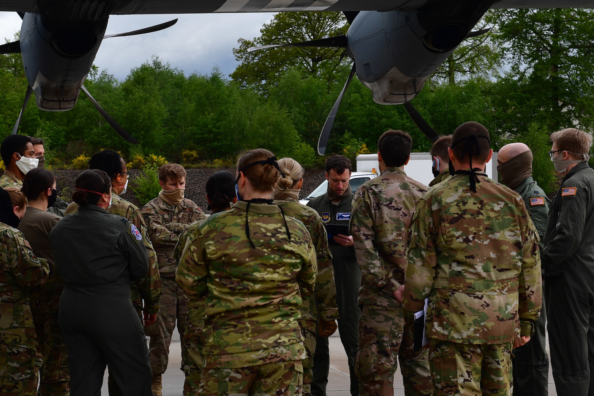 An Airman briefs a group of Airmen.