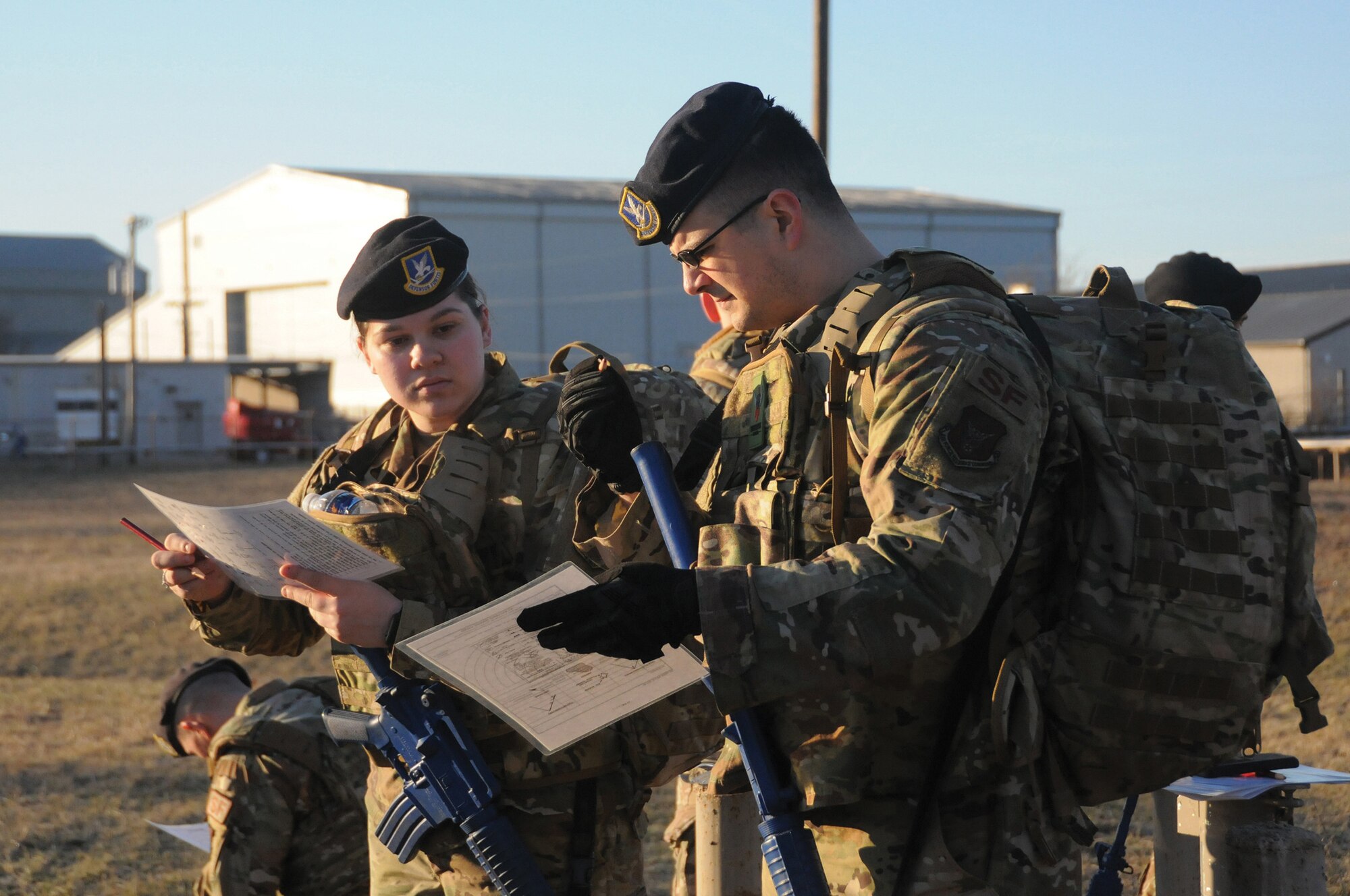 Senior Airman Krista Tungett and Staff Sgt. Kody Hildebrand from the 445th Airlift Wing Security Forces Squadron, participate in a training exercise at Wright-Patterson Air Force Base, Ohio, March 8, 2020. (U.S. Air Force photo/Senior Airman Amelia Burnett)