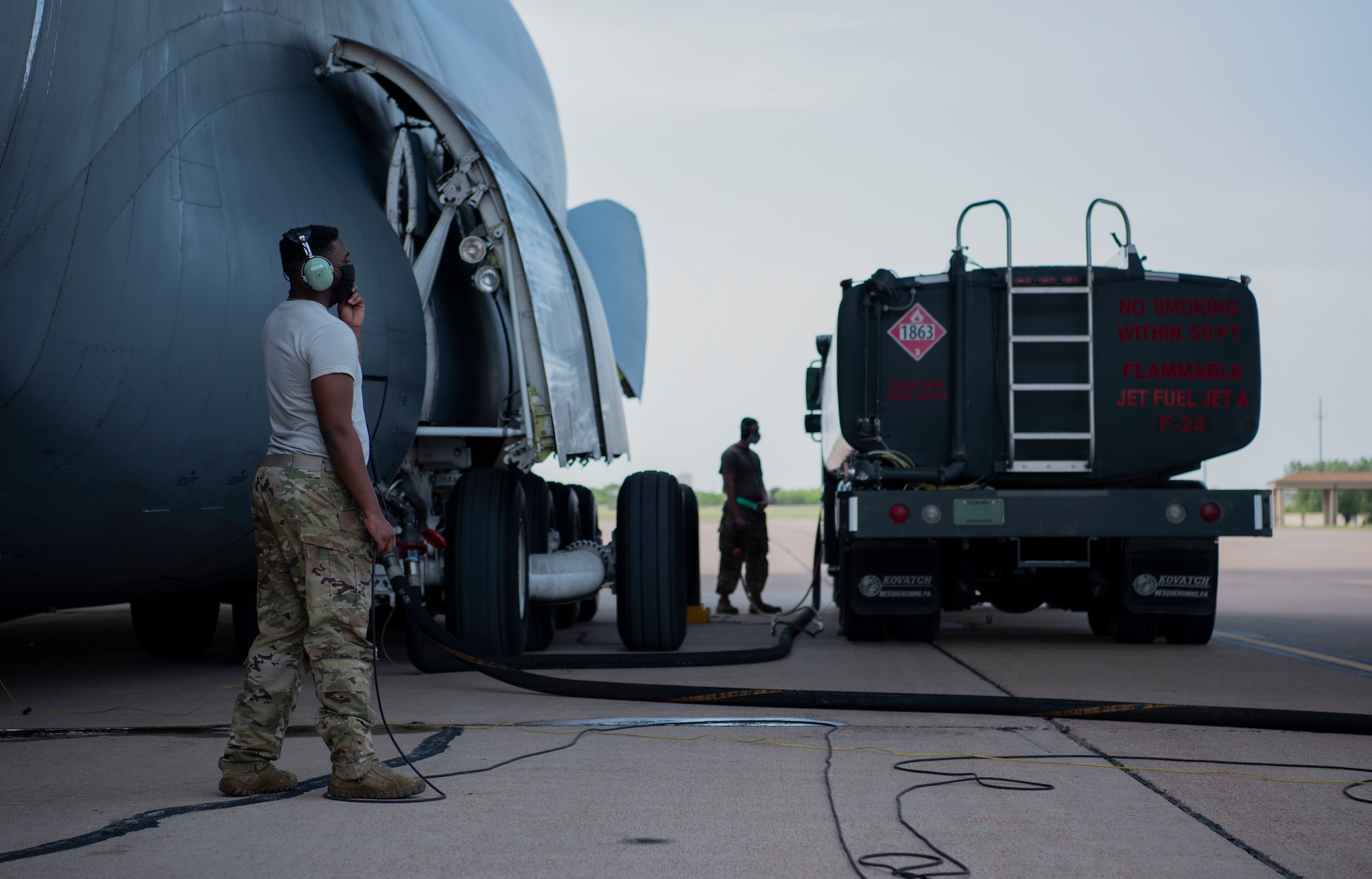 Staff Sgt. James Green, 9th Airlift Squadron, refuels a C-5 Galaxy assigned to Dover Air Force Base, Delaware, at Dyess AFB, Texas, April 27, 2020. The C-5 transported Bomber Task Force equipment for four B-1B Lancers and approximately 200 Airmen to Andersen AFB, Guam. The BTF supports Pacific Air Forces' training efforts with allies, partners and joint forces; and strategic deterrence mission to reinforce the rules-based international order in the Indo-Pacific region (U.S. Air Force photo by Airman 1st Class Nicole Molignano)