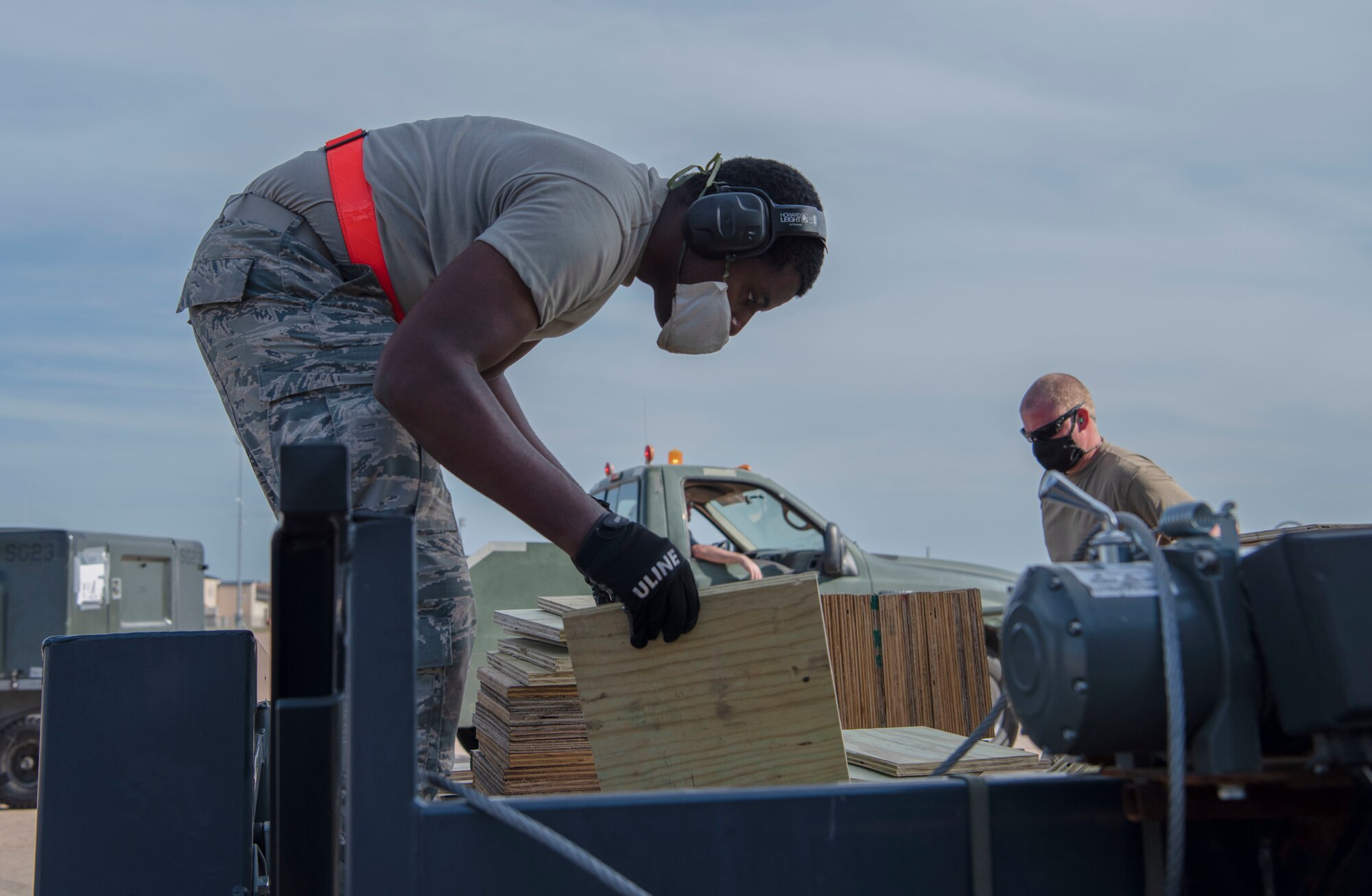 Airman 1st Class Keyshawn Jeanty (left), 7th Equipment Maintenance Squadron, prepares wooden shoring to stabilize cargo in an aircraft during flight at Dyess Air Force Base, Texas, April 27, 2020. A C-5 Galaxy assigned to Dover AFB, Delaware, transported Bomber Task Force equipment for four B-1B Lancers and approximately 200 Airmen to Andersen AFB, Guam. The BTF supports Pacific Air Forces' training efforts with allies, partners and joint forces; and strategic deterrence mission to reinforce the rules-based international order in the Indo-Pacific region (U.S. Air Force photo by Airman 1st Class Nicole Molignano)