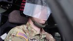 1st Lt. Nick Sinopoli, a pilot with the Wisconsin Army National Guard’s 1st Battalion, 147th Aviation Regiment, wearing a visor he created that can shift from clear to obscured to help pilots learn to transition from visual to instrumental flying when visibility outside the aircraft is suddenly limited.
