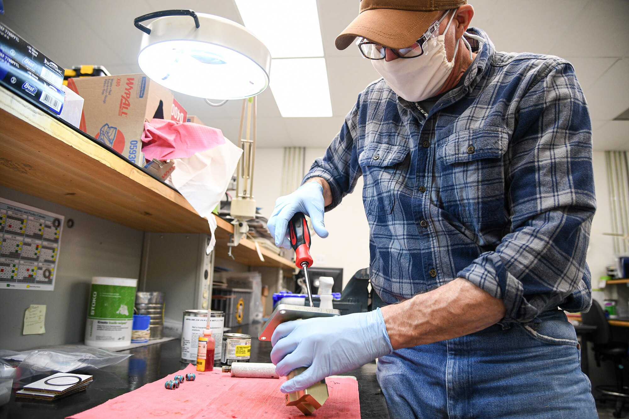 Jeff Mumford, 309th Commodities Maintenance Group, works on F-16 fuel system components.