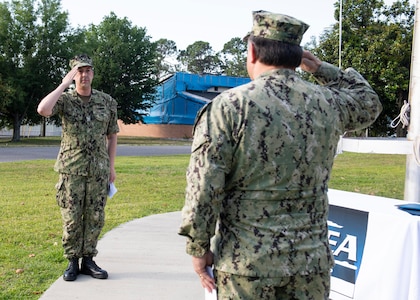 Capt. David N. Back relieved Capt. Aaron S. Peters as commanding officer, Naval Surface Warfare Center Panama City Division (NSWC PCD) in a small ceremony at the headquarters flagpole May 8 in accordance with COVID-19 social distancing requirements.