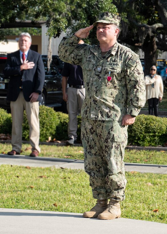 Capt. David N. Back relieved Capt. Aaron S. Peters as commanding officer, Naval Surface Warfare Center Panama City Division (NSWC PCD) in a small ceremony at the headquarters flagpole May 8. After leading the command through Category 5 Hurricane Michael and the rebuilding process, and now through the COVID-19 pandemic, Peters will retire without the fanfare typically afforded a Navy leader after more than three decades in service to the nation.