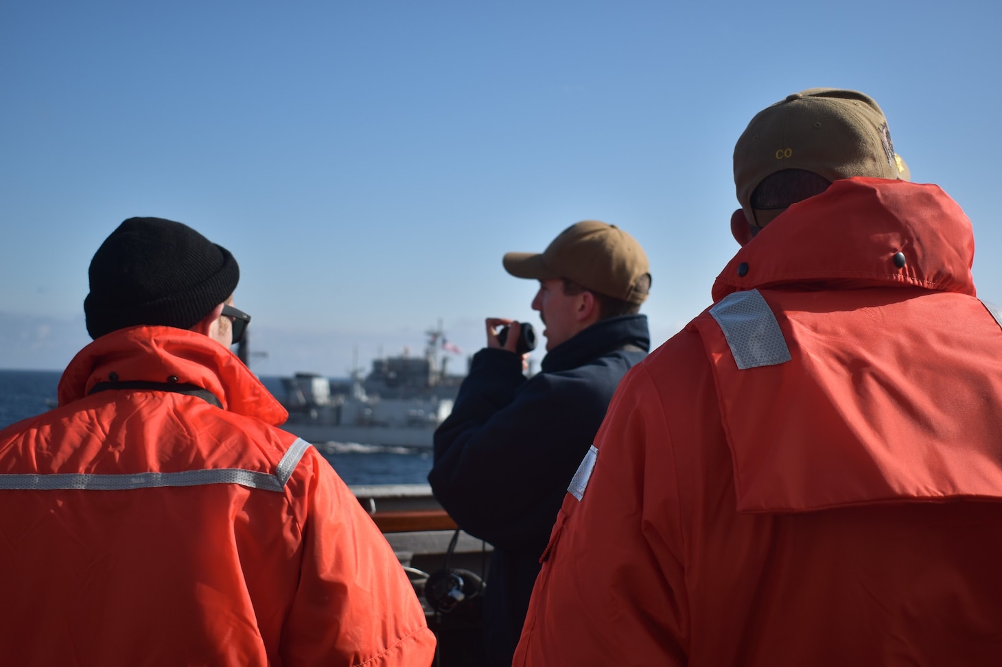 200505-N-NO901-1002 NORTH SEA (May 5, 2020) Ensign Joseph Minicucci (left), Ensign Josh Ten Eyck (center), and Cmdr. Craig Trent, commanding officer of the Arleigh Burke-class guided-missile destroyer USS Porter (DDG 78), oversee a maneuvering exercise, May 5, 2020. Porter, forward-deployed to Rota, Spain, is on its eighth patrol in the U.S. 6th Fleet area of operations in support of U.S. national security interests in Europe and Africa. (U.S. Navy photo by Information Technology Specialist 1st Class Miguel Palacio/Released)