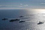 ARCTIC OCEAN (May 5, 2020) The Type-23 Duke-class frigate HMS Kent (F78), the Arleigh Burke-class guided-missile destroyer USS Roosevelt (DDG 80), the Arleigh Burke-class guided-missile destroyer USS Porter (DDG 78), the Arleigh Burke-class guided-missile destroyer USS Donald Cook (DDG 75), and USNS Supply (T-AOE-6) conduct a photo exercise (PHOTOEX) while conducting joint operations to ensure maritime security in the Arctic Ocean, May 5, 2020.