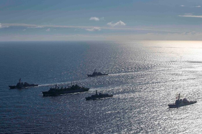 ARCTIC OCEAN (May 5, 2020) The Type-23 Duke-class frigate HMS Kent (F78), the Arleigh Burke-class guided-missile destroyer USS Roosevelt (DDG 80), the Arleigh Burke-class guided-missile destroyer USS Porter (DDG 78), the Arleigh Burke-class guided-missile destroyer USS Donald Cook (DDG 75), and USNS Supply (T-AOE-6) conduct a photo exercise (PHOTOEX) while conducting joint operations to ensure maritime security in the Arctic Ocean, May 5, 2020.