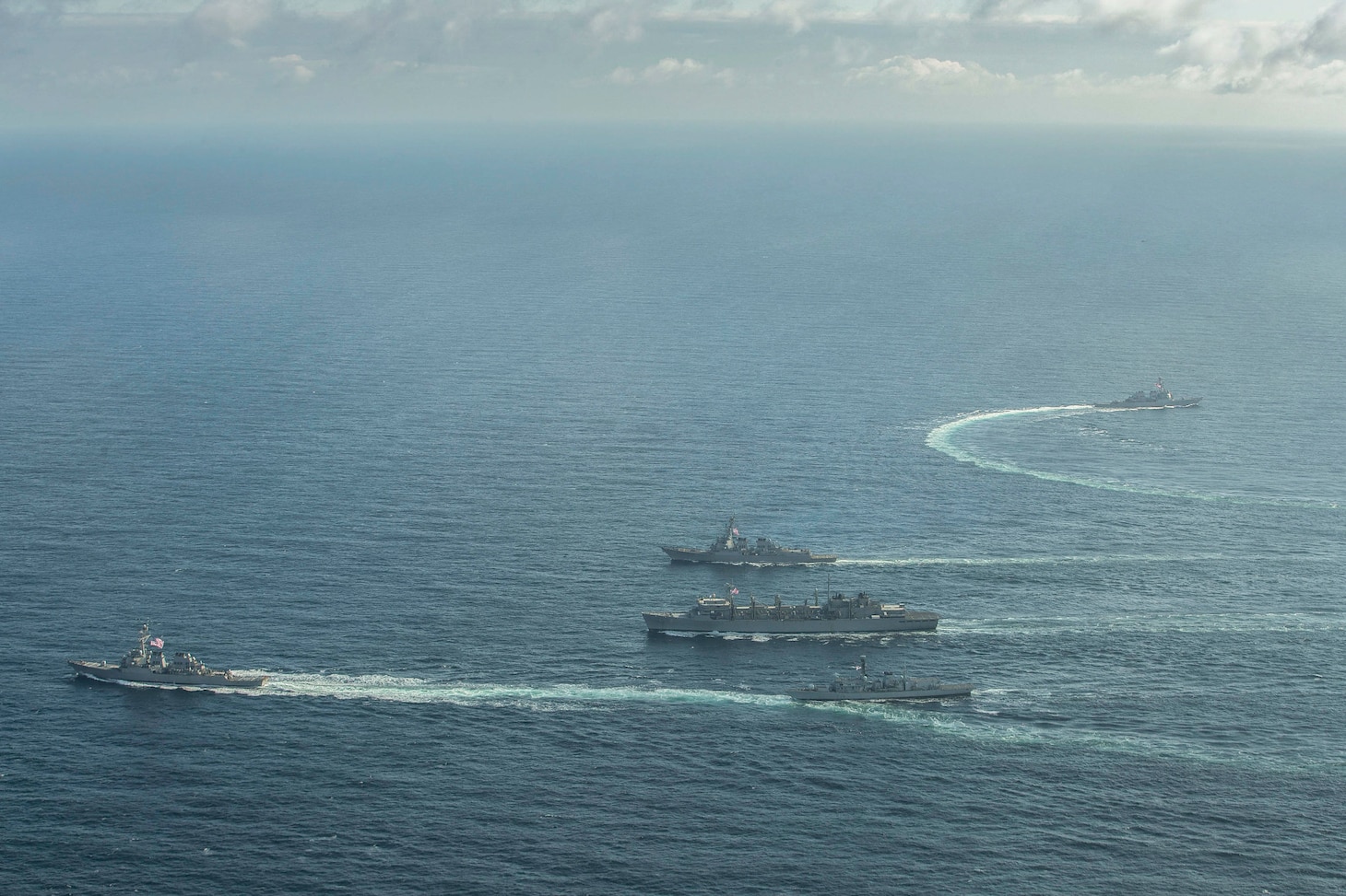 ARCTIC OCEAN (May 5, 2020) The Type-23 Duke-class frigate HMS Kent (F78), the Arleigh Burke-class guided-missile destroyer USS Roosevelt (DDG 80), the Arleigh Burke-class guided-missile destroyer USS Porter (DDG 78), the Arleigh Burke-class guided-missile destroyer USS Donald Cook (DDG 75), and USNS Supply (T-AOE-6) conduct a photo exercise (PHOTOEX) while conducting joint operations to ensure maritime security in the Arctic Ocean, May 5, 2020