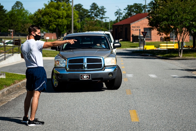Photo of Airman directing traffic.