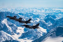Two F-35A Lightning IIs assigned to the 356th Fighter Squadron and two F-16 Fighting Falcons assigned to the 18th Aggressor Squadron fly over Denali National Park in Alaska May 5, 2020.