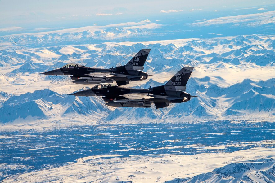 Two F-16 Fighting Falcons assigned to the 18th Aggressor Squadron fly over Denali National Park May 5, 2020.