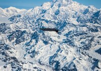 An F-35A Lightning II assigned to the 356th Fighter Squadron performs an inverted maneuver over Denali National Park in Alaska May 5, 2020.