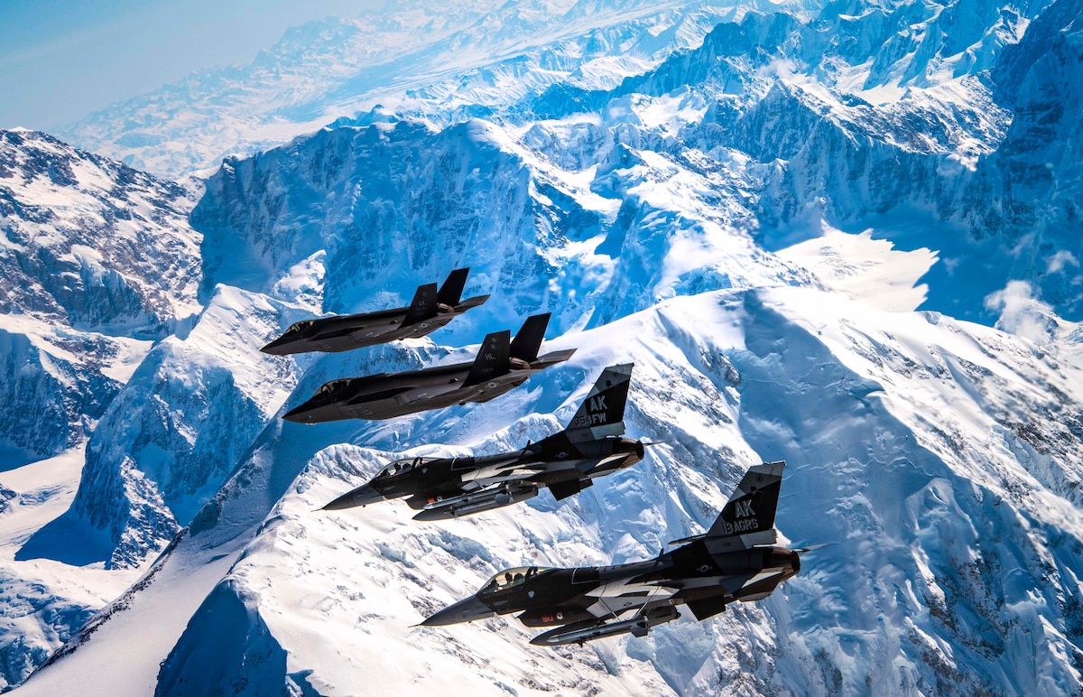 Two F-35A Lightning IIs assigned to the 356th Fighter Squadron and two F-16 Fighting Falcons assigned to the 18th Aggressor Squadron fly over Denali National Park in Alaska May 5, 2020.