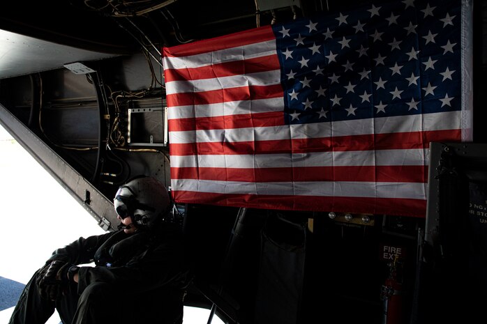 A U.S. Marine with Marine Medium Tiltrotor Squadron 268, Marine Aircraft Group 24, watches a taxiway from the rear of an MV-22B Osprey, Marine Corps Air Station Kaneohe Bay, Marine Corps Base Hawaii, May 5, 2020. The squadron conducted escort lane training with live-fire to better familiarize the crew and promote interoperability between the squadron and MAG-24 squadrons. (U.S. Marine Corps photo by Sgt. Alex Kouns)