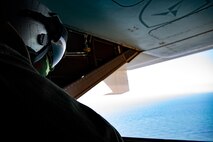A U.S. Marine with Marine Medium Tiltrotor Squadron 268, Marine Aircraft Group 24, watches from the rear of an MV-22B Osprey, Oahu, Hawaii, Marine Corps Base Hawaii, May 5, 2020. The squadron conducted escort lane training with live-fire to better familiarize the crew and promote interoperability between the squadron and MAG-24 squadrons. (U.S. Marine Corps photo by Sgt. Alex Kouns)