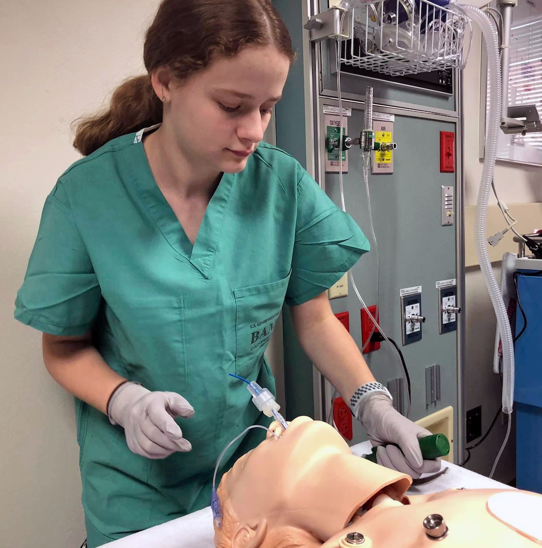 Amber Miller, youth volunteer, works in the Simulation Center at Brooke Army Medical Center, Joint Base San Antonio-Fort Sam Houston, July 9, 2019. Miller hopes to inspire others to donate blood during the COVID-19 crisis.