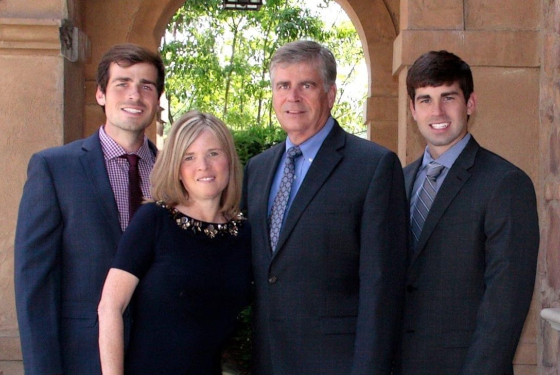 Family of four pose for photograph