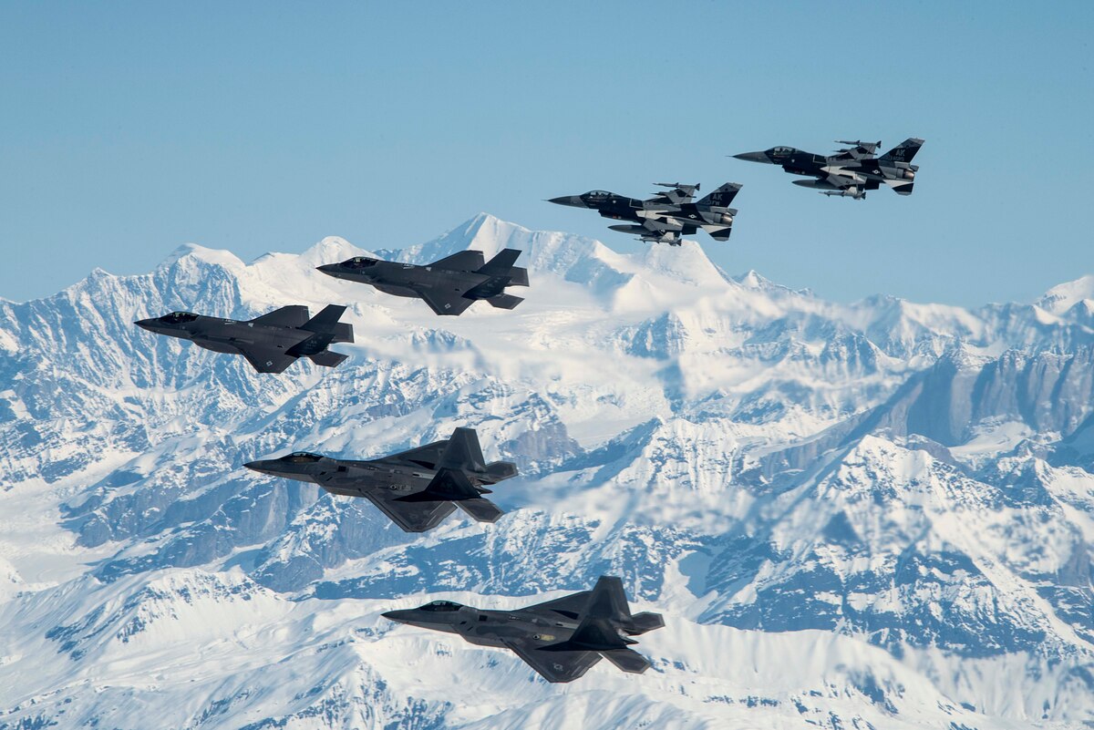 Two F-35A Lightning IIs and two F-16 Fighting Falcons assigned to Eielson Air Force Base fly alongside two F-22 Raptors assigned to Joint Base Elmendorf-Richardson as part of a mass formation flight May 5, 2020.