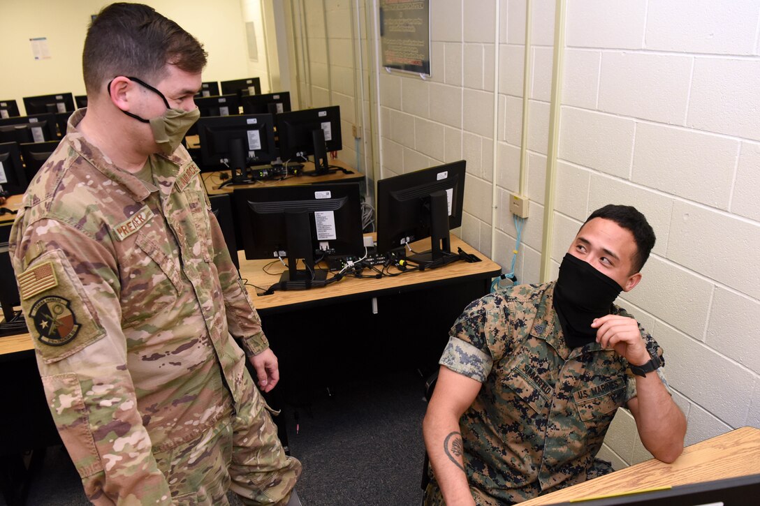 A Marine and airman training.