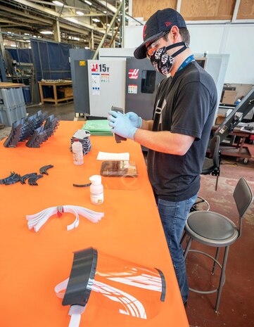 Rico Montalvo, a toolmaker with Shop 31, assembles face shields for use during the COVID-19 outbreak Tuesday, May 5 in Building 431 at Puget Sound Naval Shipyard & Intermediate Maintenance Facility in Bremerton.