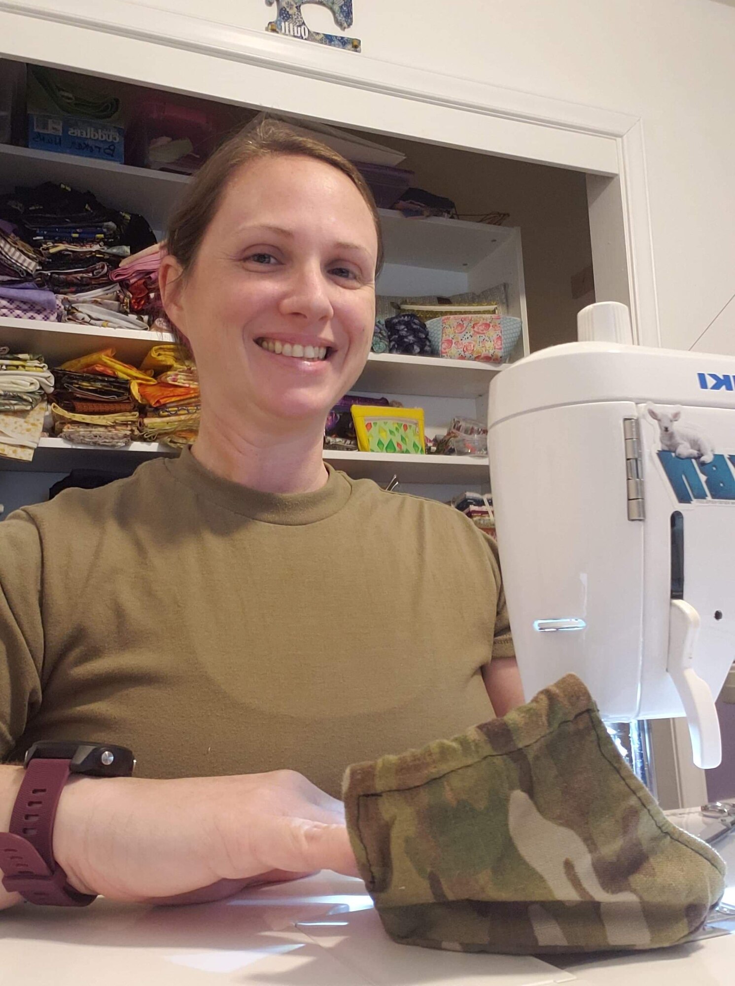 From her sewing machine at home, Staff Sgt. Rachel Yandon works on the 150 masks she donated for a Regional Medical Center in Alabama, May 7, 2020.  She then moved on to provide masks to coworkers at the Western Air Defense Sector.