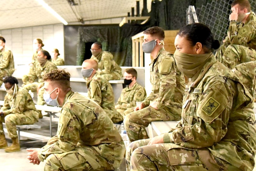 Soldiers listening to a virtual briefing.
