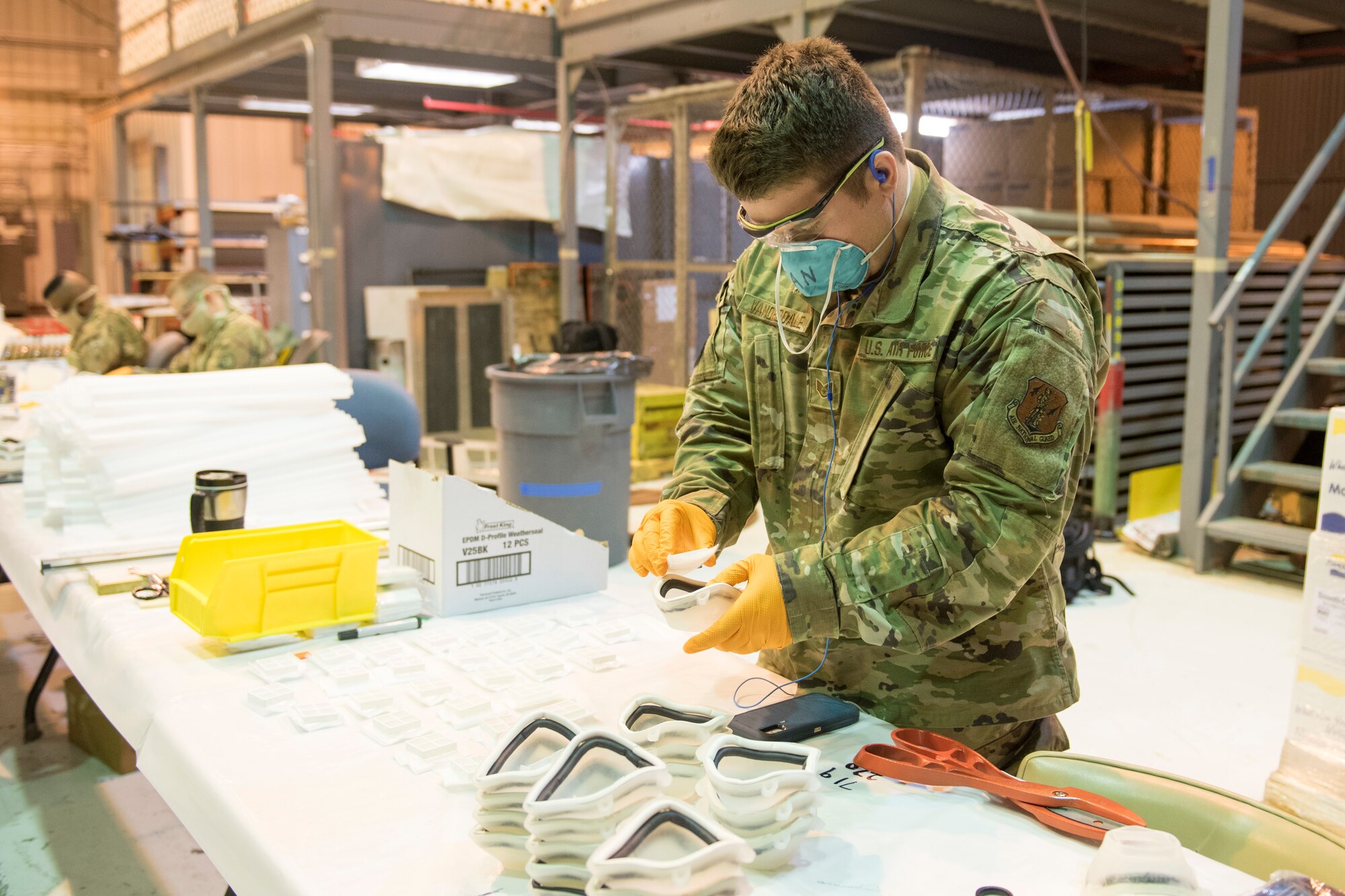 Staff Sgt. Anthony Vanorsdale, places a filter piece into an N95 face mask at the 167th Airlift Wing, April 30, 2020. West Virginia National Guardsmen assigned to Task Force Innovation have produced more than 1500 of the cast mold masks developed by staff at Shepherd University.