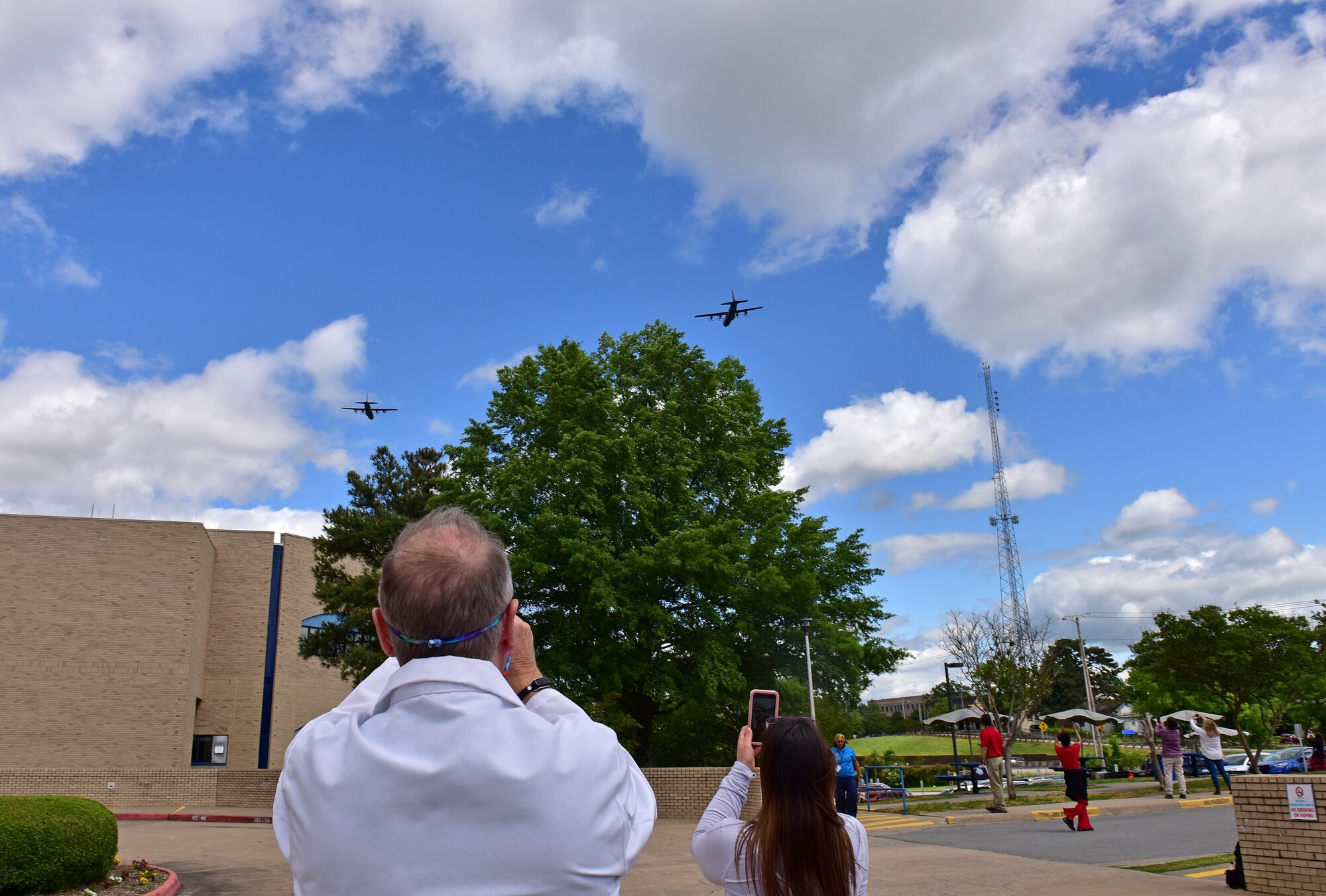 U.S. Air Force C-130s from Little Rock Air Force Base fly over Veterans Affairs Medical Center in downtown Little Rock Arkansas, May 8, 2020. The flyover was part of America Strong; a collaborative salute to recognize healthcare workers, first responders, military, and other essential personnel while standing in solidarity with all Americans during the COVID-19 pandemic. (U.S. Air Force photo by Staff Sgt. Jeremy McGuffin)