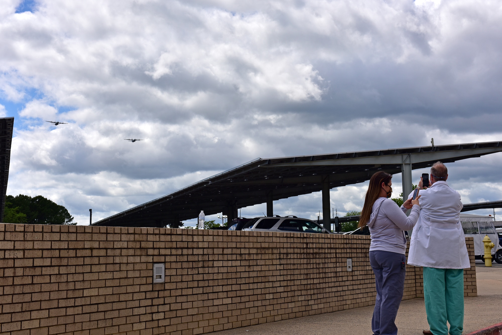 U.S. Air Force C-130s from Little Rock Air Force Base fly over Veterans Affairs Medical Center in downtown Little Rock Arkansas, May 8, 2020. The flyover was part of America Strong; a collaborative salute to recognize healthcare workers, first responders, military, and other essential personnel while standing in solidarity with all Americans during the COVID-19 pandemic. (U.S. Air Force photo by Staff Sgt. Jeremy McGuffin)