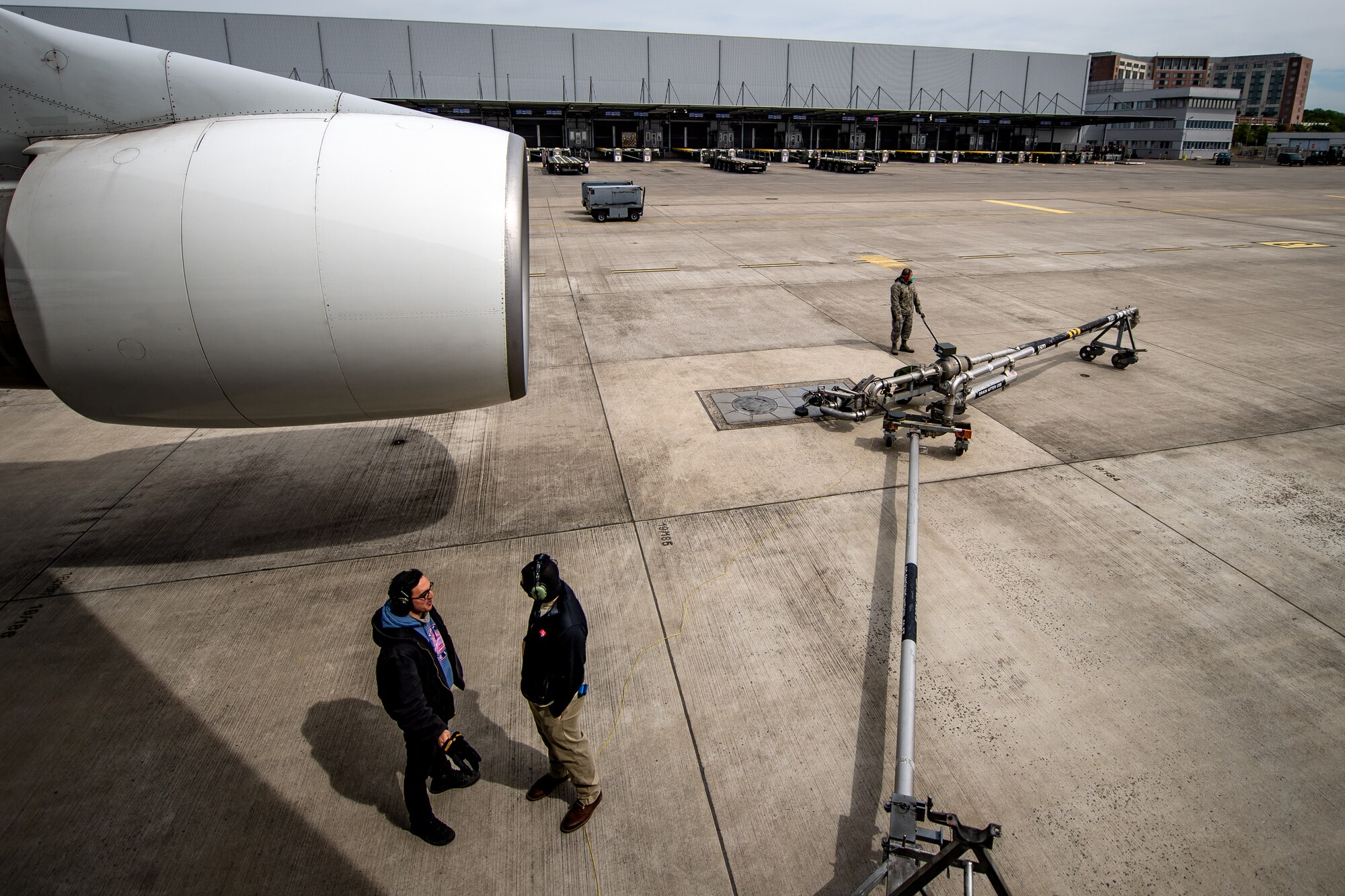 Photo of Airmen refueling a jet