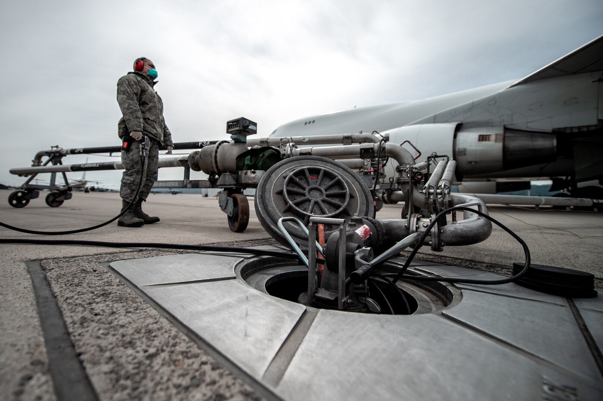 Photo of Airman refueling a jet
