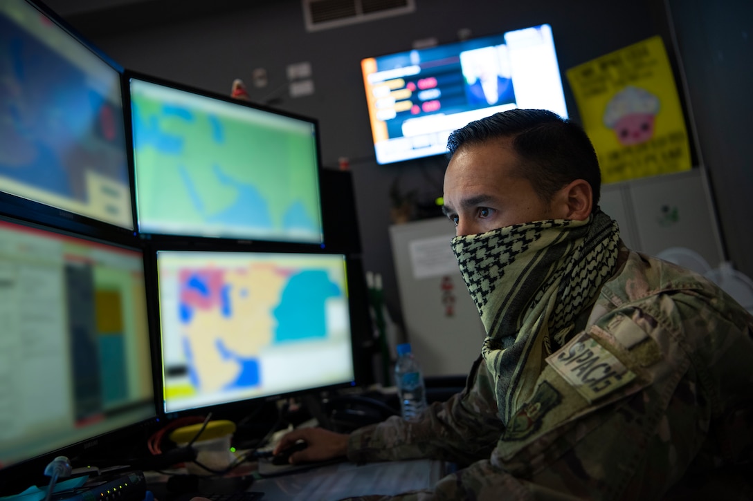 A U.S. Air Force Airman assigned to the 609th Air Operations Center performs tasks within the Combined Air Operations Center at Al Udeid Air Base, Qatar, April 20, 2020.