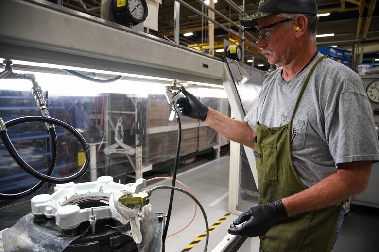 Bill Zampedri, 309th Commodities Maintenance Group E&I inspector, tests C-130 brake components.