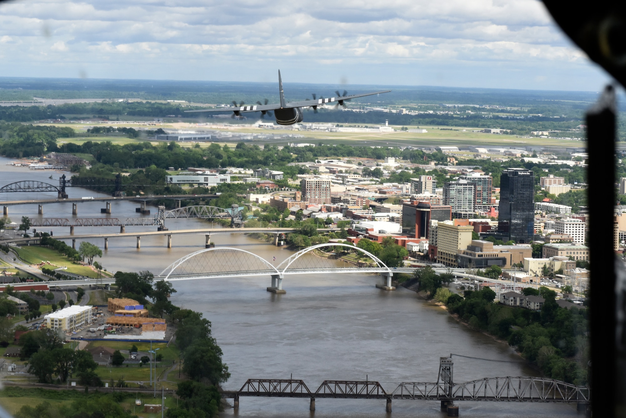 A C-130 flies of the Arkansas River