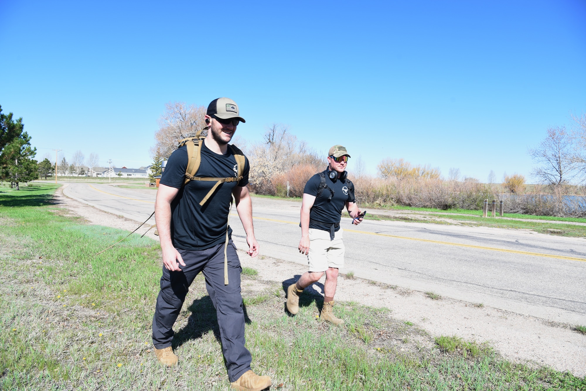 Sergeant Rosenquist and Airman Cole start their ruck march