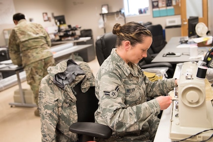 Airman 1st Class Summer Wilson sews cloth face masks at the 167th Airlift Wing, April 30, 2020. Wilson is part of the West Virginia National Guards Task Force Innovation which is producing protective face coverings as part of the COVID-19 response efforts. Wilson taught herself how to sew by watching online videos so she could sew masks for the task force.