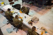 West Virginia National Guard Airmen and Soldiers put the finishing pieces, including filters and head straps, on N-95 face masks cast from molded silicone at the 167th Airlift Wing, April 30, 2020. The Guardsmen are part of Task Force Innovation and have produced well over 1,500 masks. The masks were designed by Shepherd University staff after a shortage of off-the-shelf masks due to COVID-19. The mask’s designers provided the molds and training to the Guardsmen to enable to mask production.
