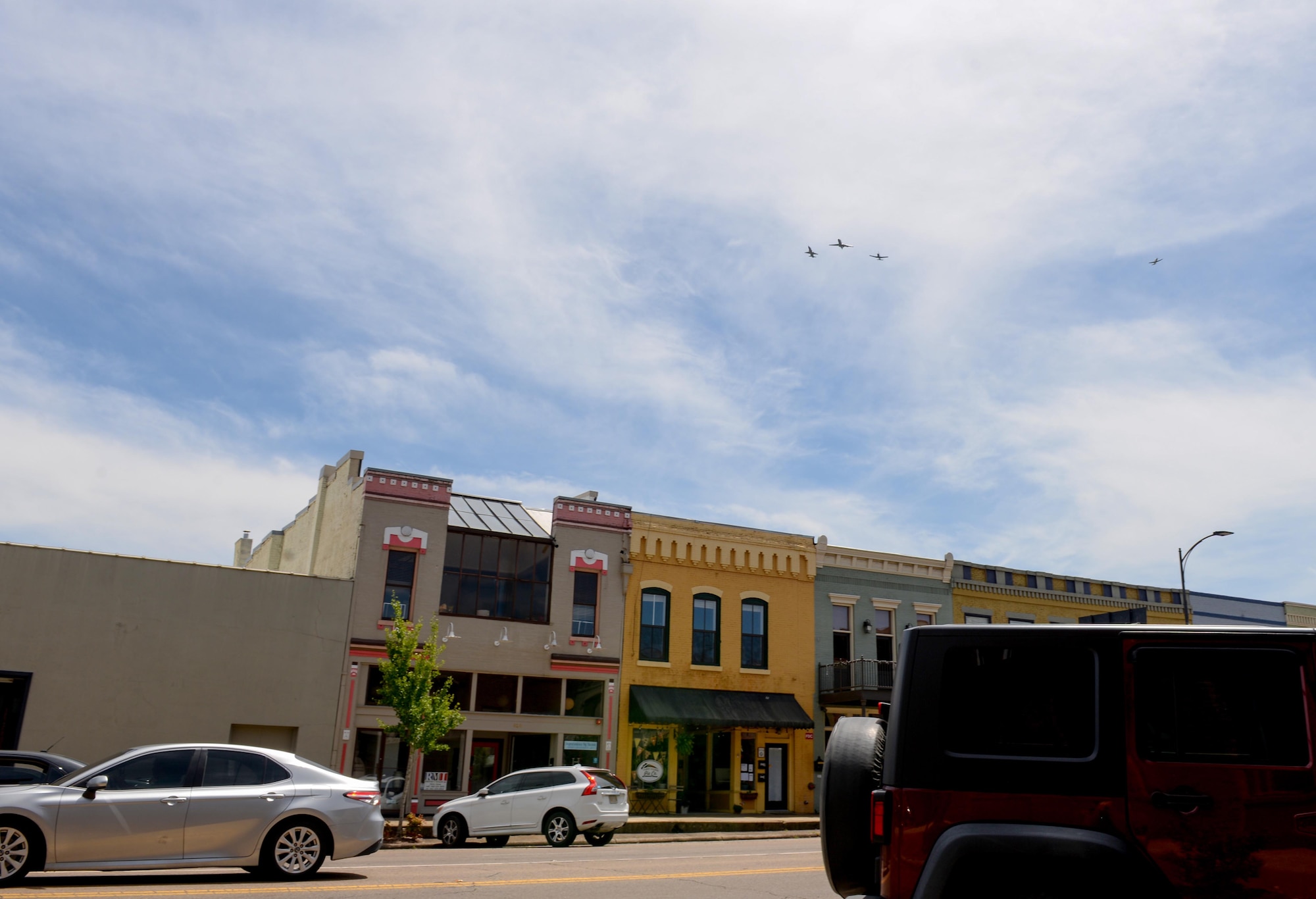 A dissimilar formation of aircraft from Columbus Air Force Base, Miss., fly over Main Street in Columbus, Miss. on May 9, 2020. The flyover was an opportunity to honor the men and women on the front lines in the fight against COVID-19 during the Defense Department’s #AmericaStrong salute. The flyover consisted of the T-6A Texan II, T-1A Jayhawk and the T-38 Talon. (U.S. Air Force photo by Airman 1st Class Davis Donaldson)