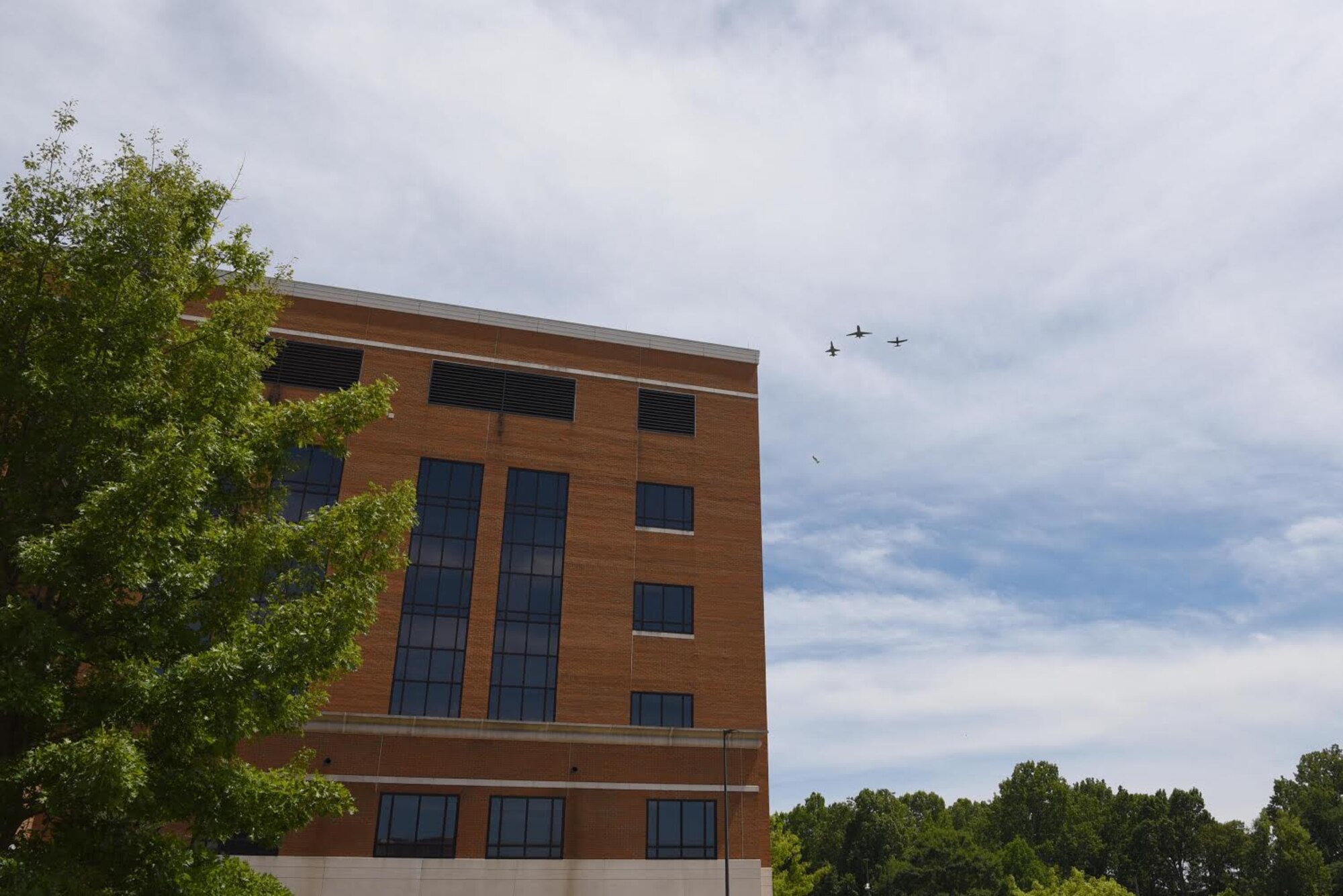 A dissimilar formation of aircraft from Columbus Air Force Base, Miss., fly over Baptist Memorial Hospital in Columbus, Miss. May 9, 2020. The flyover was an opportunity to honor the men and women on the front lines in the fight against COVID-19 during the Defense Department’s #AmericaStrong salute. The flyover consisted of the T-6A Texan II, T-1A Jayhawk and the T-38 Talon. (U.S. Air Force photo by Airman 1st Class Jake Jacobsen)