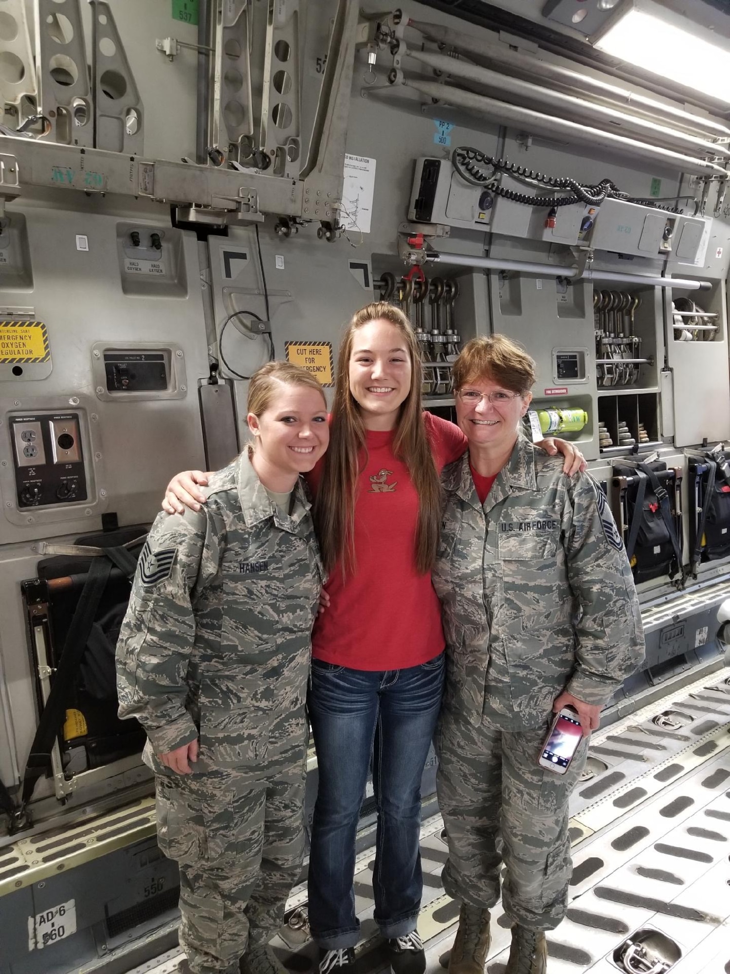 Three women pose for photo