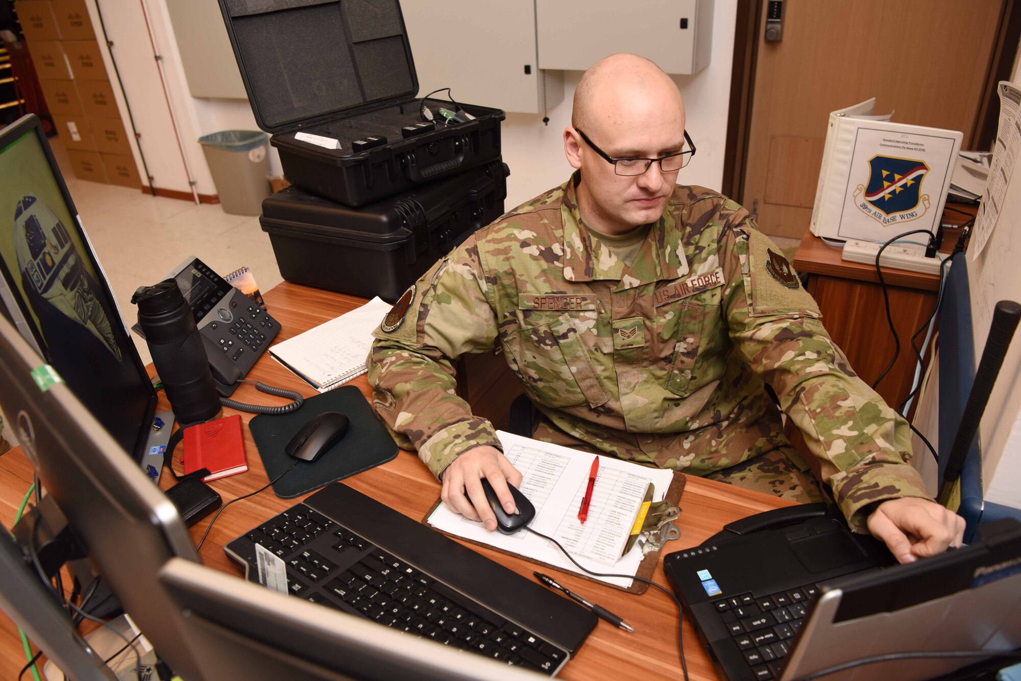 Photo of Airman working on his computer