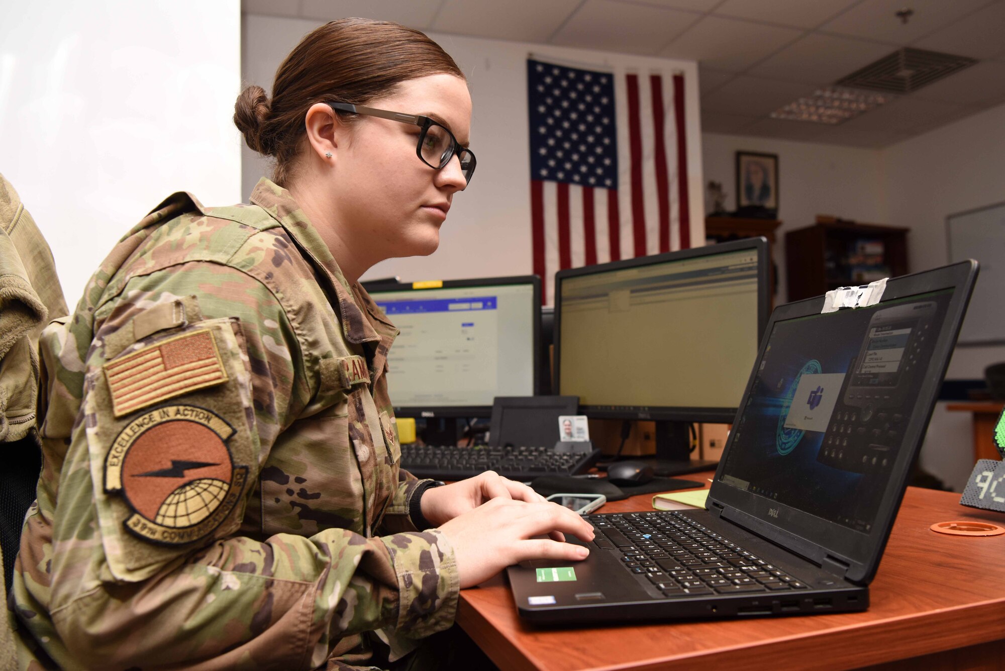 Photo of Airman typing on a computer