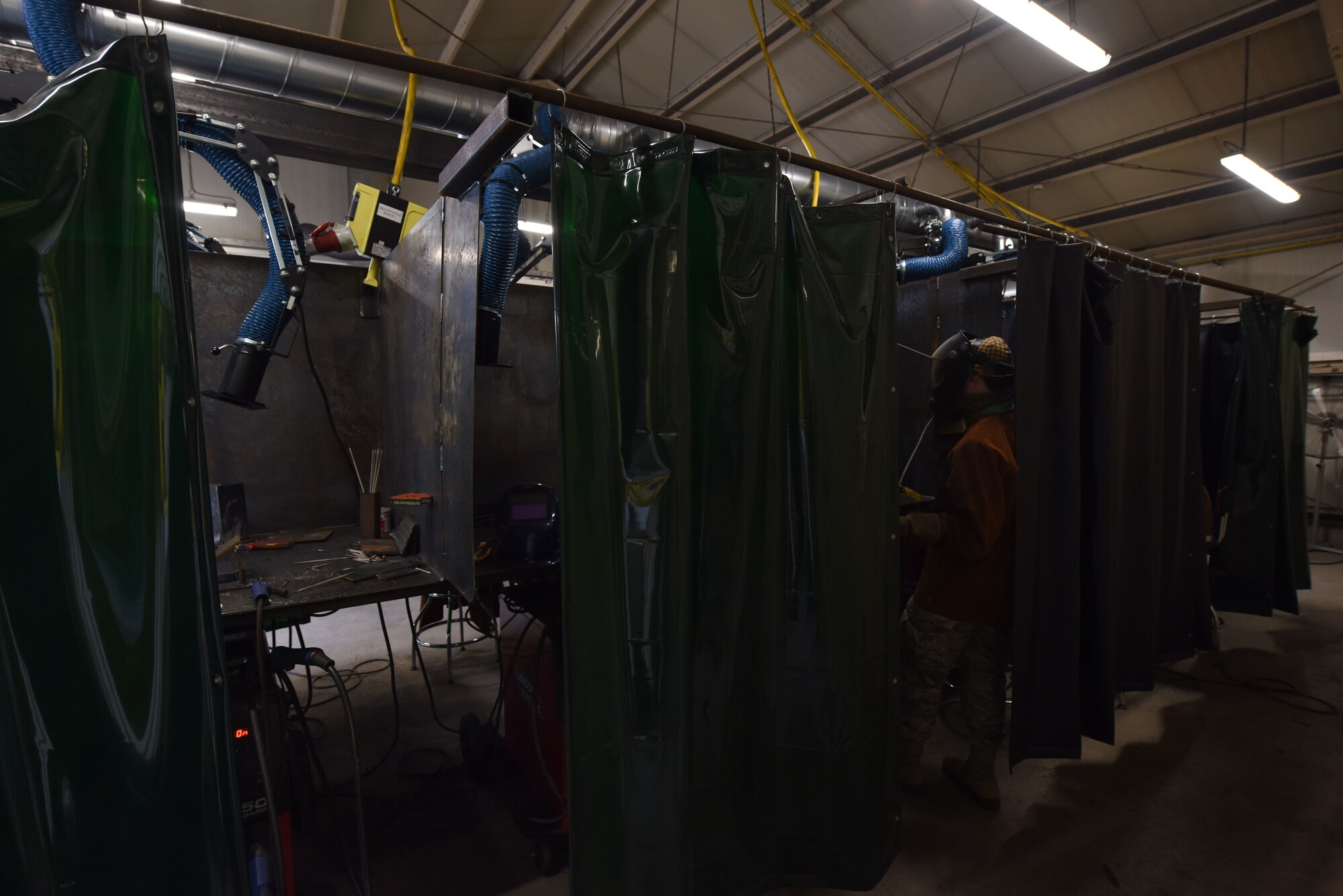 An Airman assigned to the 786th Civil Engineer Squadron stands at a welding work station during a 435th Contingency and Training Squadron welding course.