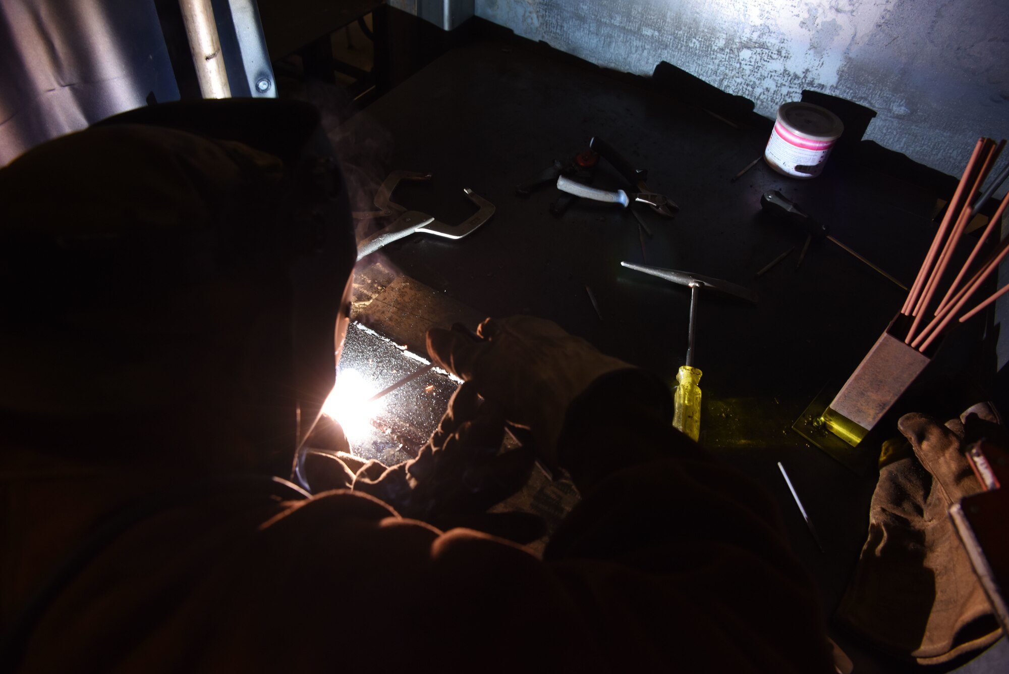 U.S. Air Force Staff Sgt. Israel Gutierrez, 786th Civil Engineer Squadron lock shop noncommissioned officer in charge, fuses metal during a welding course.